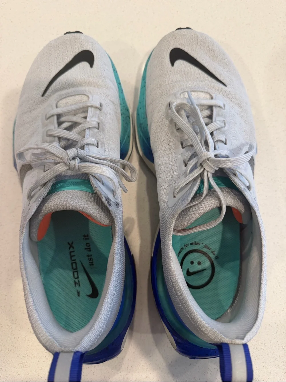 Nike Mens size 8 or Women’s 9.5 Grey ZoomX Invincible Sneakers with Blue Accents